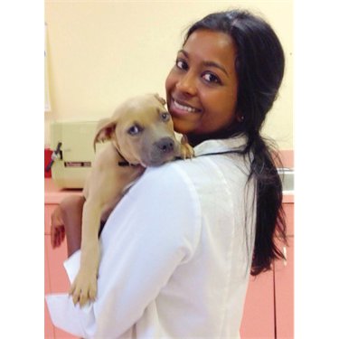 Dr. Cynthia Henriquez holding dog
